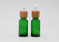 Botellas de cristal cosméticas verdes del dropper del aceite 18m m con la pipeta de bambú de la impresión del dropper